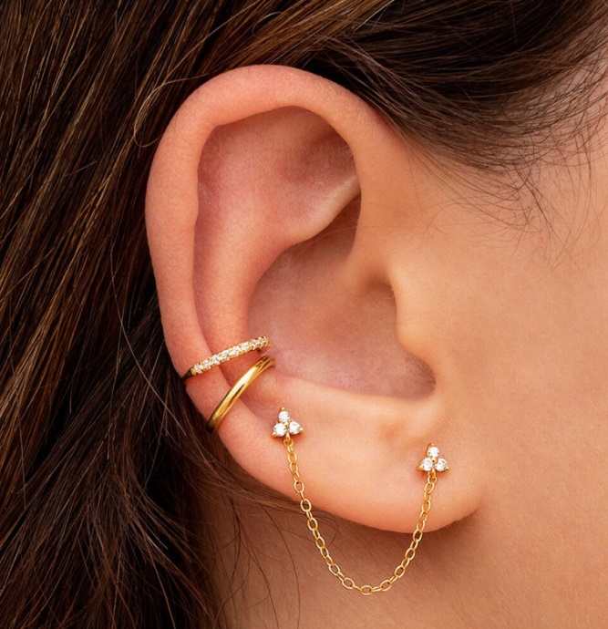 A close-up view of the Link Chain Stud Earrings Set worn on an ear, highlighting the delicate chain and sparkling stone.