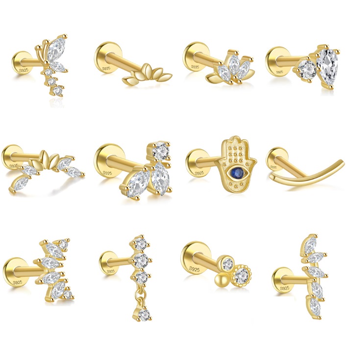 A collection of various gold-plated 925 sterling silver minimalist stud earrings with cubic zirconia.