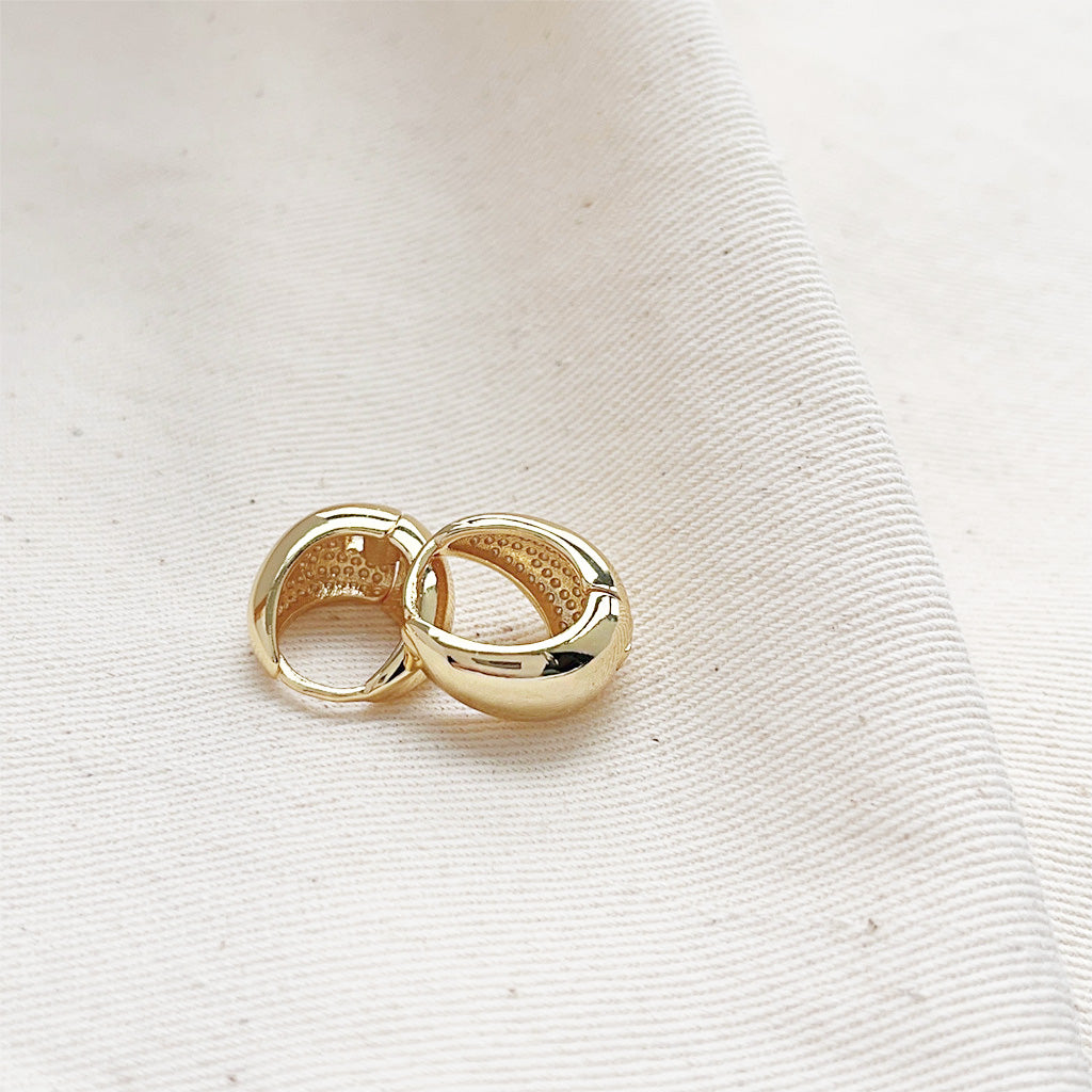 Detailed view of the gold-plated teardrop hoop earrings