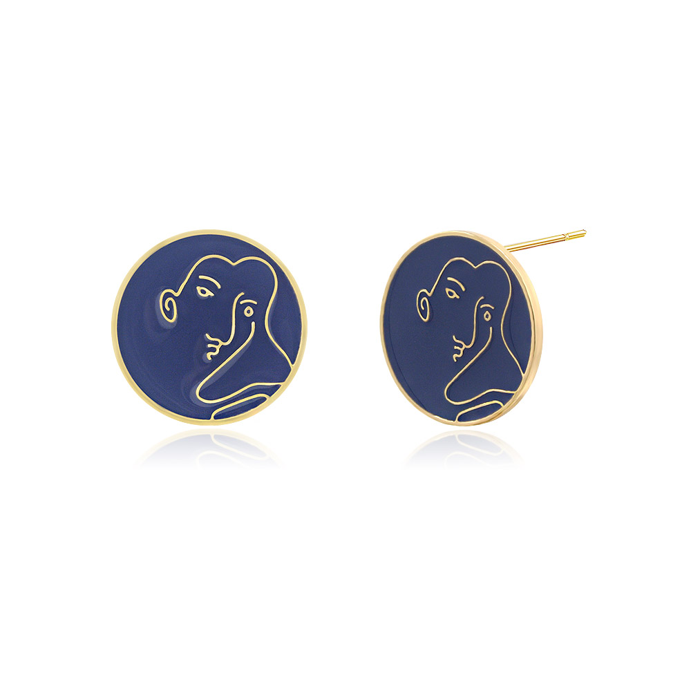 Detailed view of the purple enamel face stud earring showing the gold profile design.