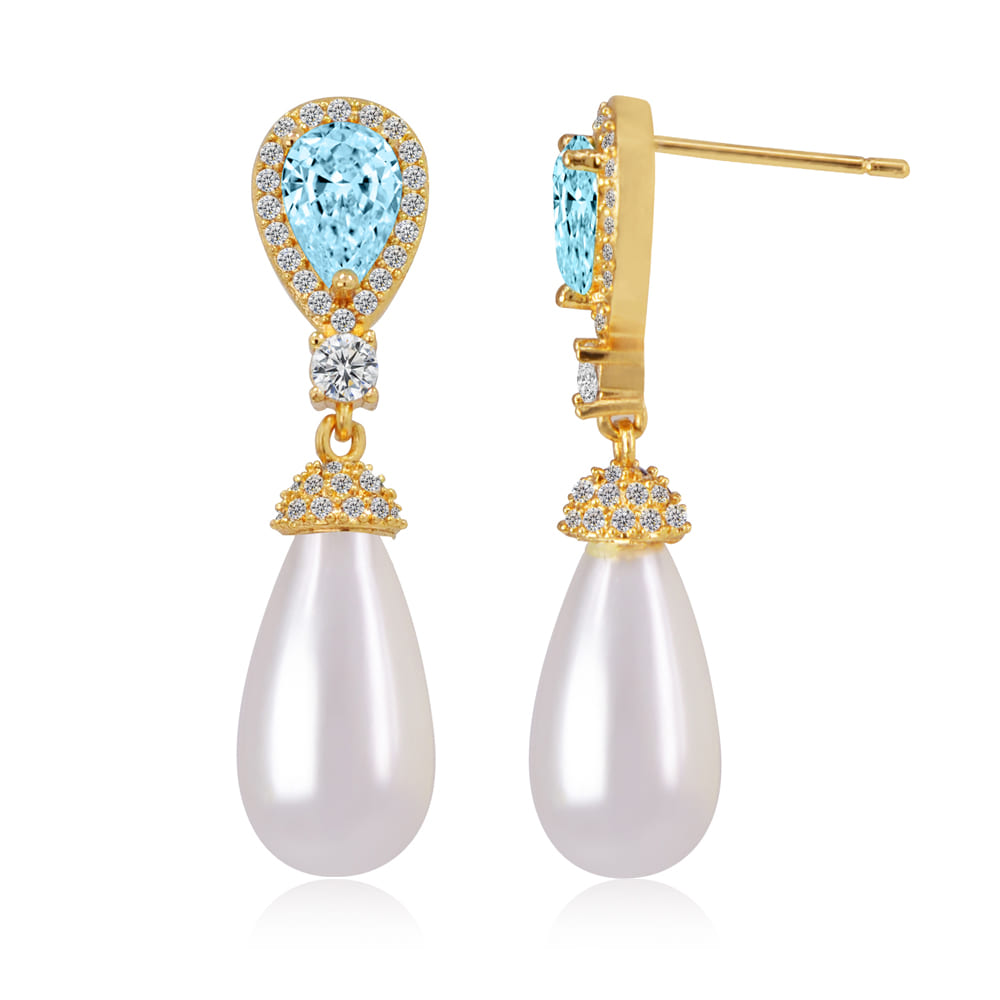 Detailed view of the gold-plated earrings with blue gemstones and white pearls