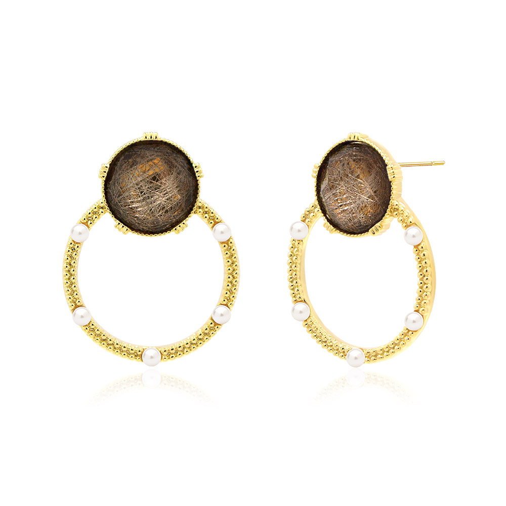 A model showcasing the Brown Glitter Resin Gold Earrings