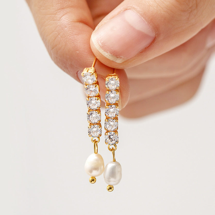 Detailed view of the pearl and CZ stones on the tassel earrings