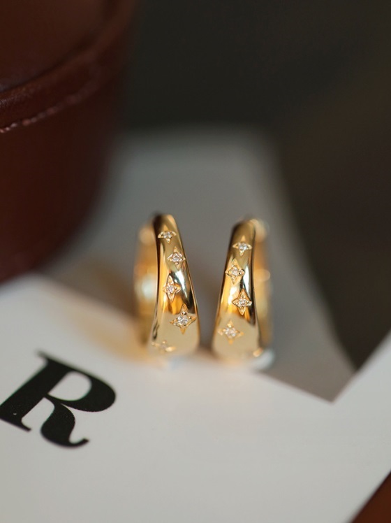 Close-up view of the 925 Sterling Silver Star Hoop Earring showcasing the cubic zirconia detail.