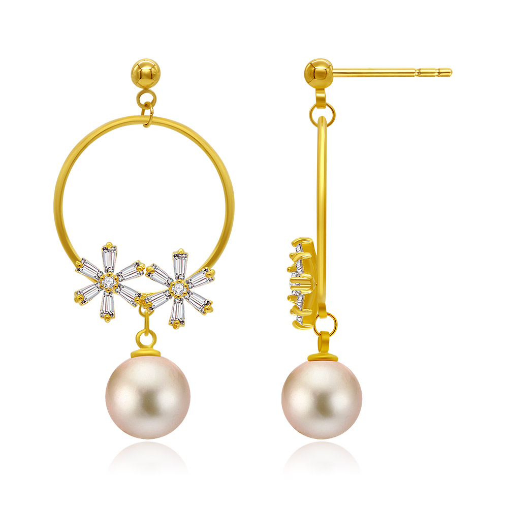 Detailed view of the pearl and cubic zirconia on the gold plated earrings