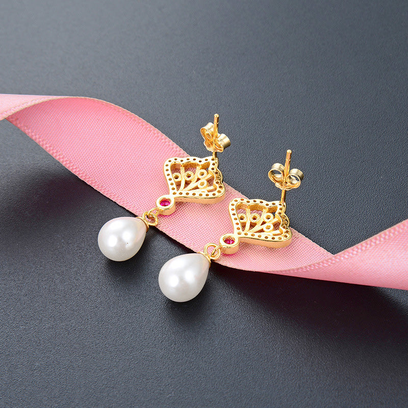 Elegant display of the princess style pearl drop earrings