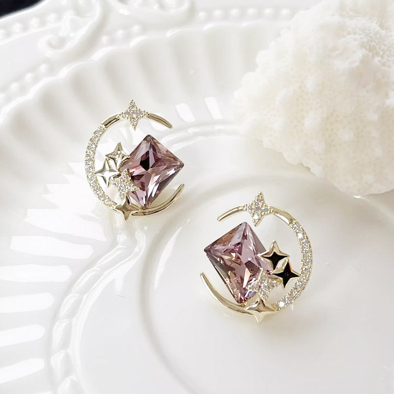 Full set of five pairs of 14k gold-plated celestial-themed stud earrings with pink crystals.