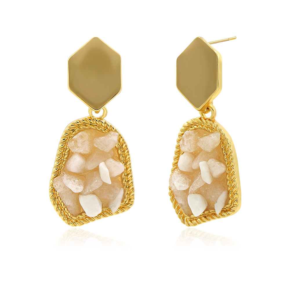 Close-up of the beige raw stone earrings