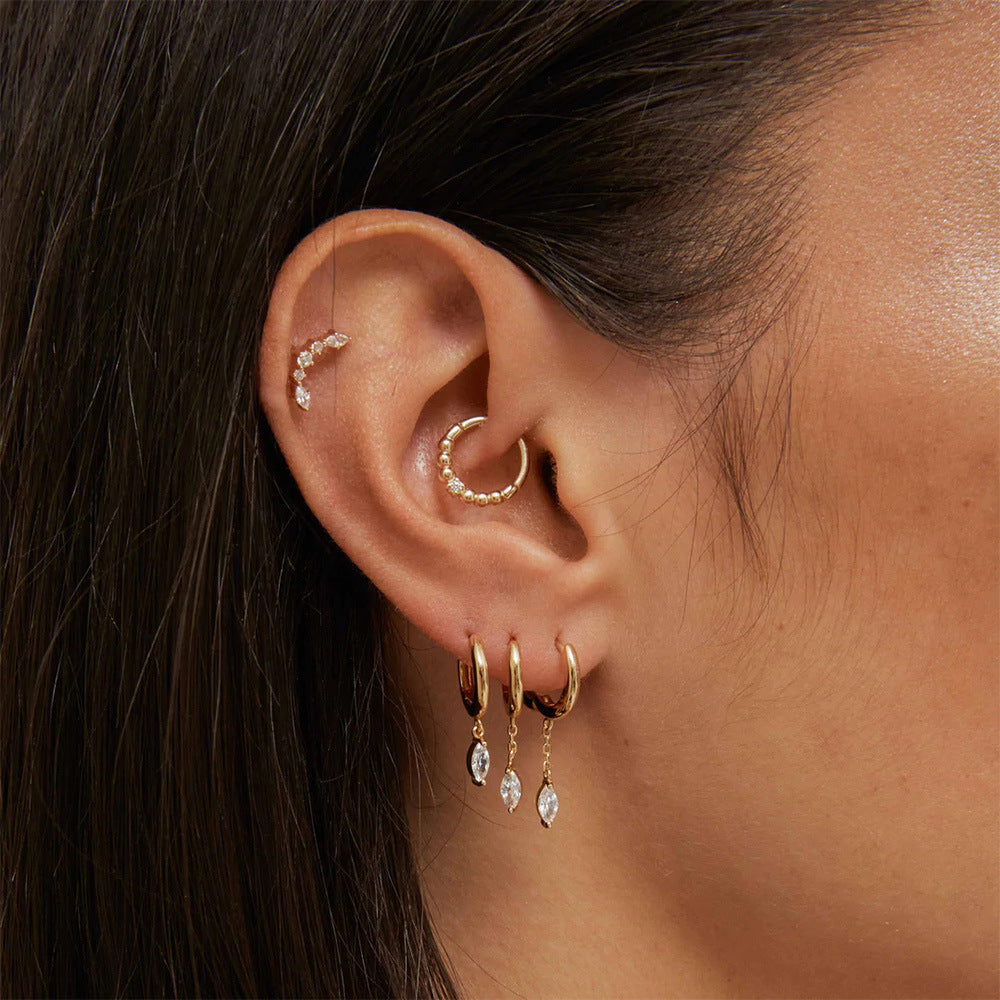 A model wearing the elegant gold-plated sterling silver CZ drop earrings.