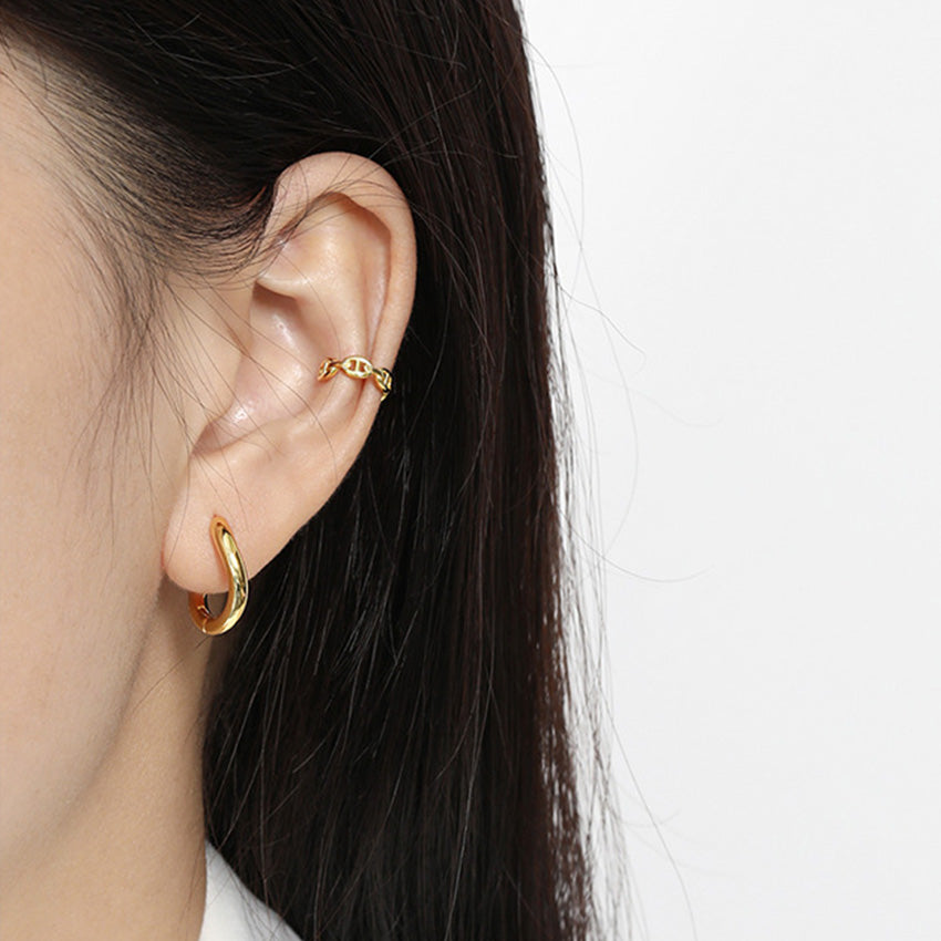 Model wearing the minimalist 18K gold plated earrings for daily style.