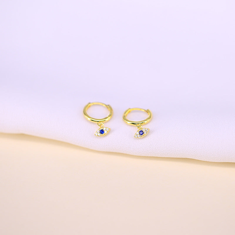 Gold version of the evil eye hoop earrings with blue zircon