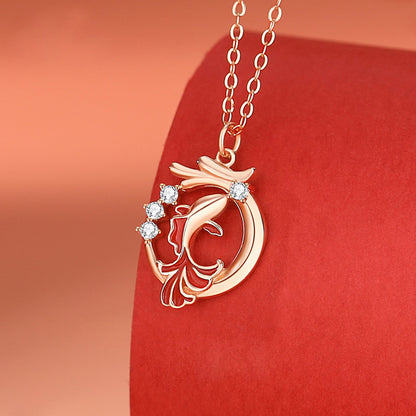 A close-up of the gold fish dragon pendant in 925 sterling silver, showcasing its detailed design on a display stand.