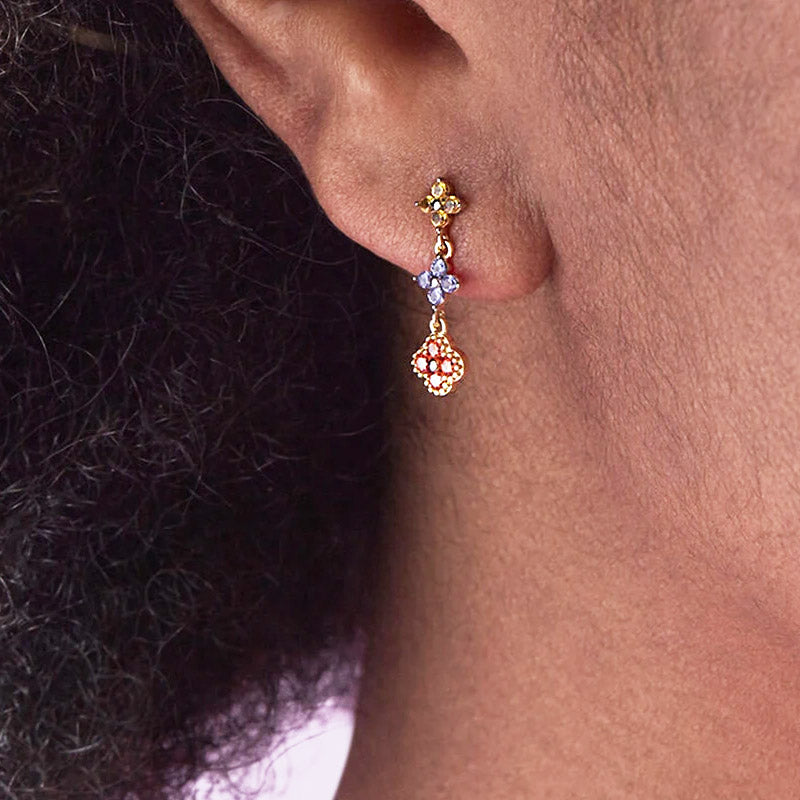 Detailed view of the gold triple flower earring