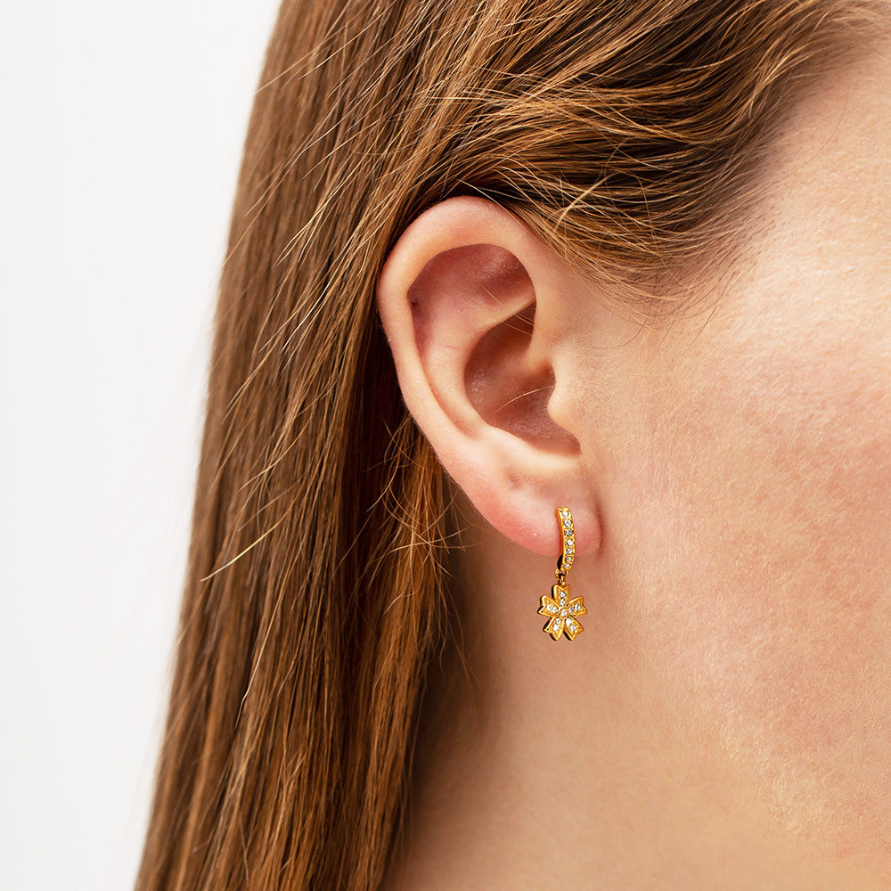 Model showcasing the beautiful gold zircon flower drop earring
