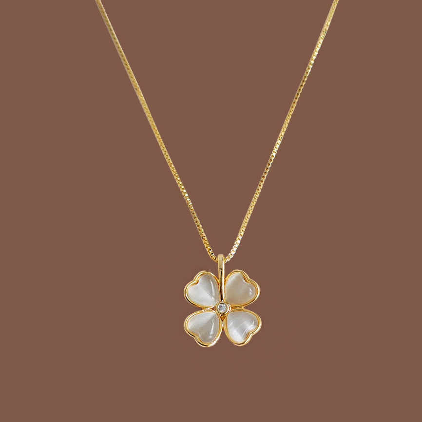 Detailed view of the four-leaf clover pendant necklace