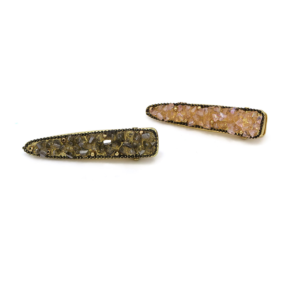 Two variations of the Fashion Crystal Hair Clip, one with dark stones and one with pink stones.