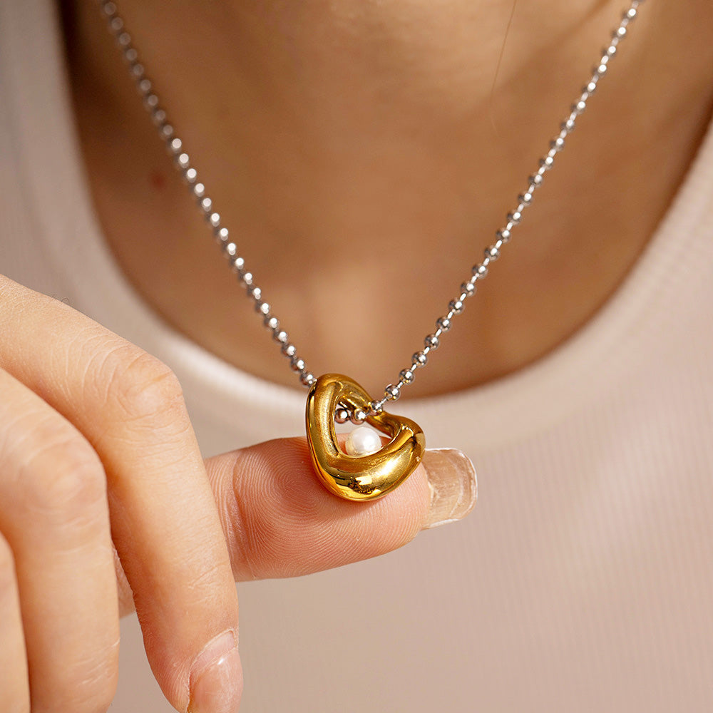 Detailed view of the geometric pearl pendant necklace