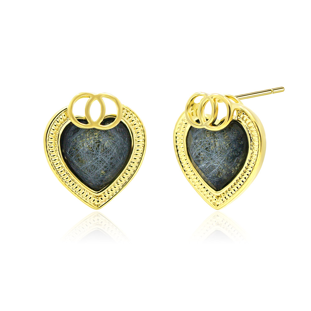 A detailed side view of the Gold Glitter Heart Stud Earrings