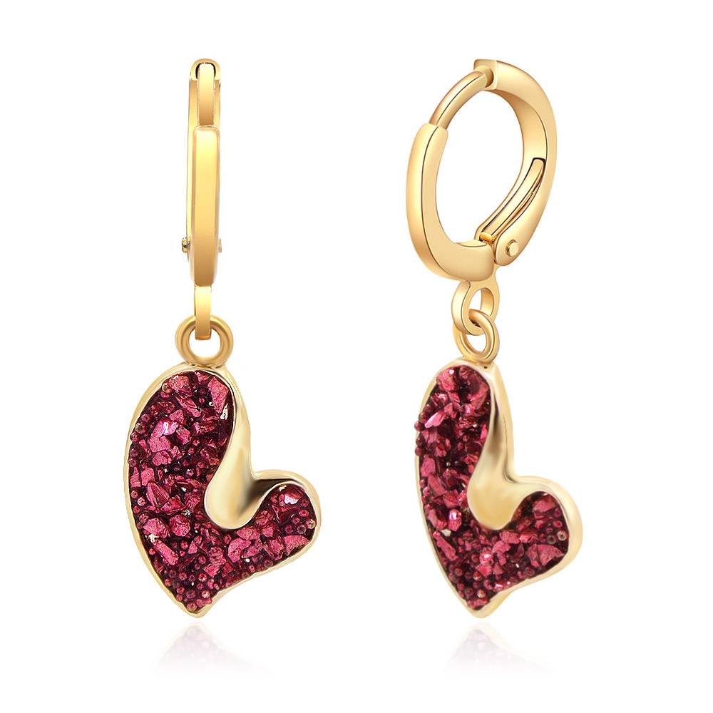 Detailed view of the red glitter heart drop earrings