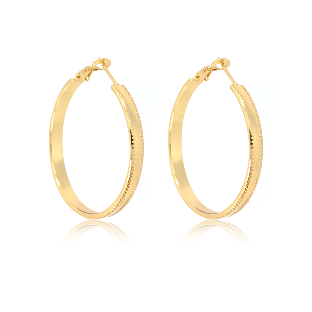 Side view of the medium gold hoop earrings showing the smooth exterior