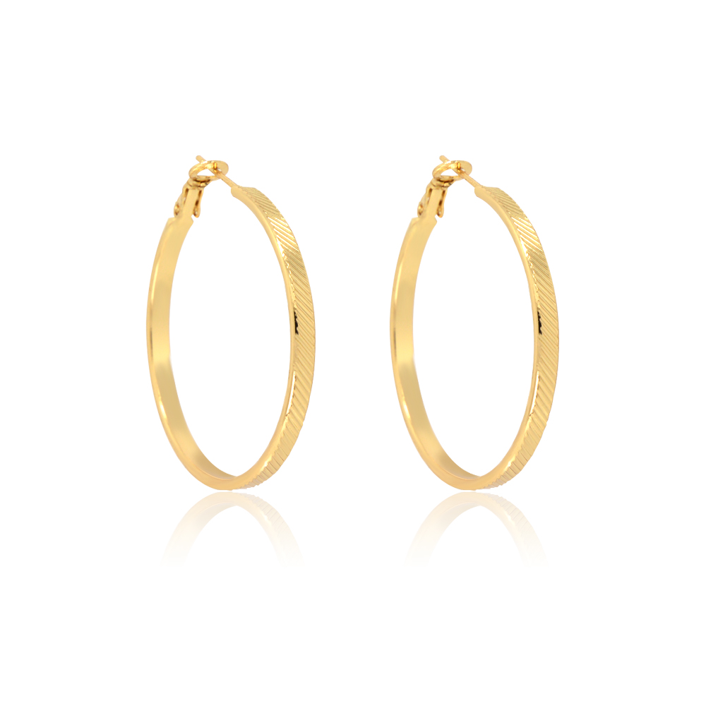 Detailed texture of the gold hoop earring