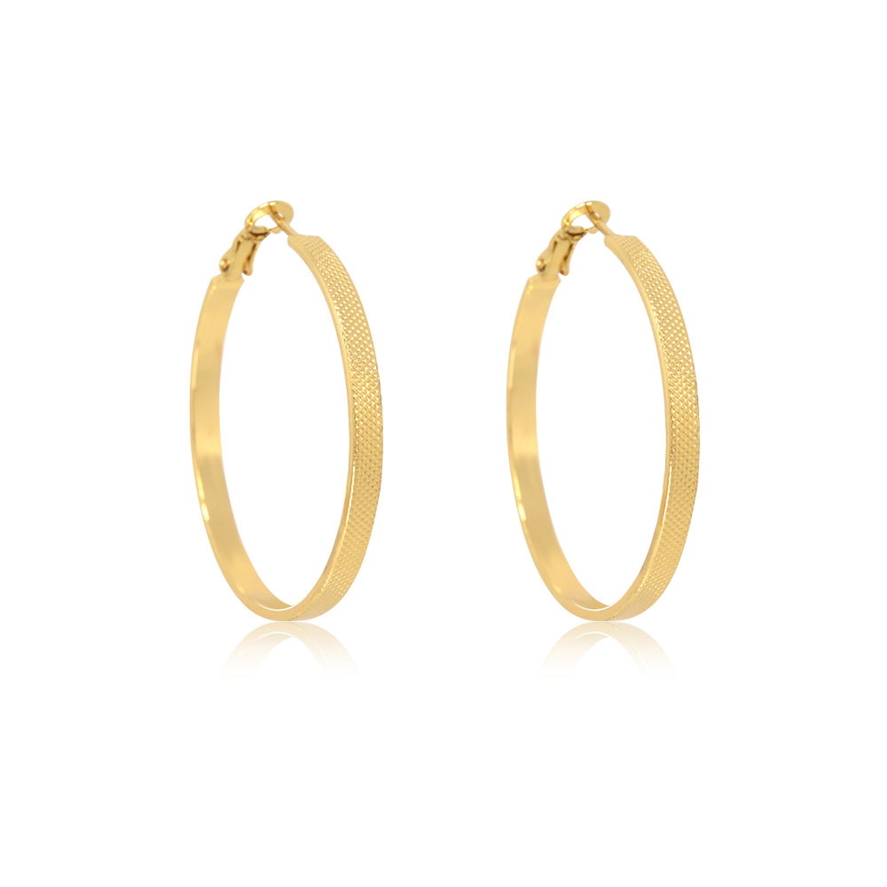 Close-up view of the textured exterior of the Gold Dots Hoop Earrings
