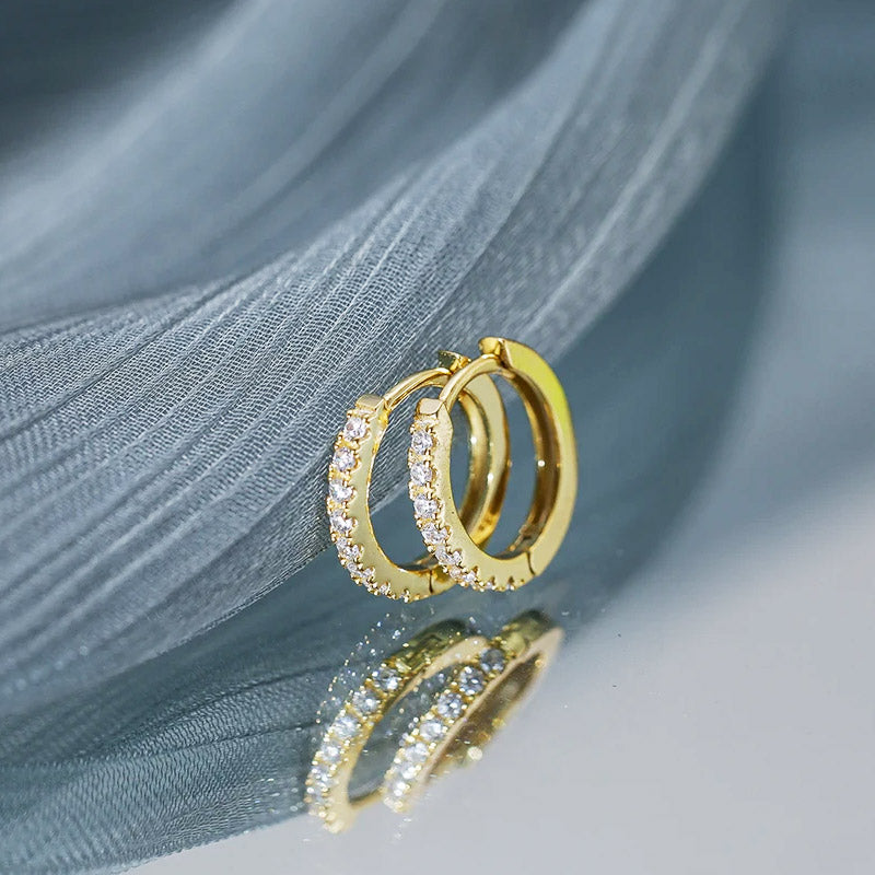A detailed, high-quality shot of the gold hoop earrings with gemstones, showcasing the fine craftsmanship available from JR Fashion Accessories.