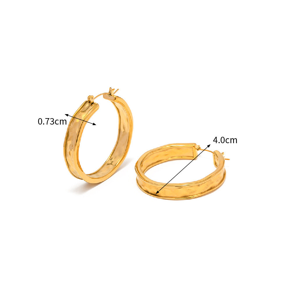 Detailed measurements of the gold hoop earrings, showing a 4.0cm diameter and 0.73cm width.