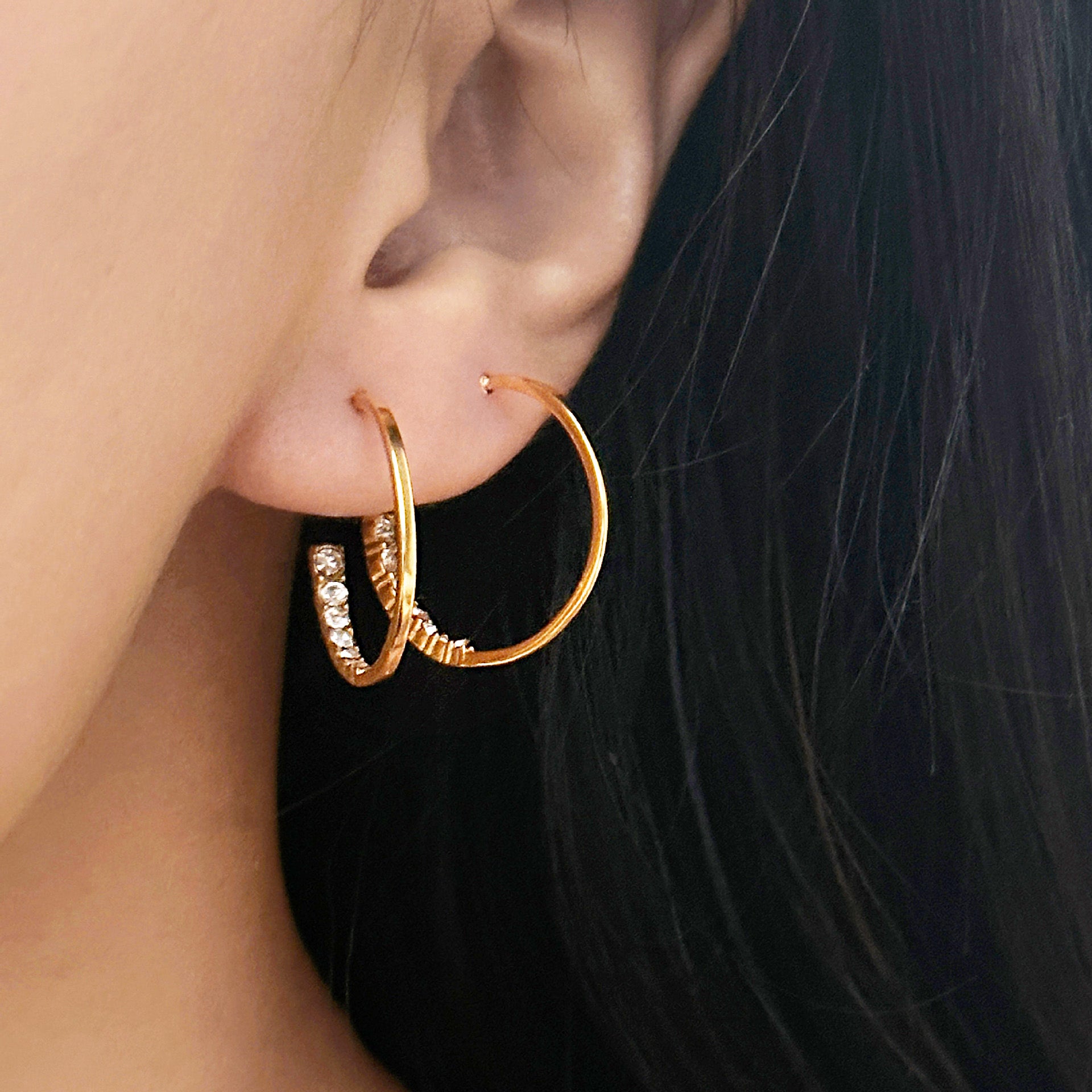 Model showcasing the elegant fit of the C-shape zirconia hoop earrings.