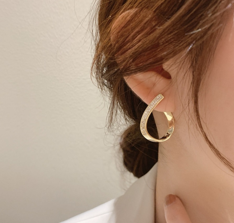 Model showcasing the elegant drop of the Tear Drop Crystal Earrings