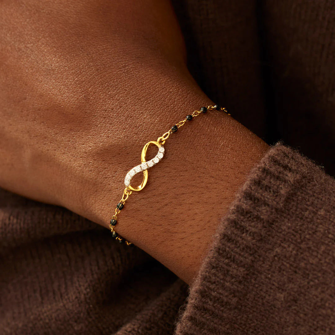 A model wearing the Infinity of Hope Elegant Beaded Bracelet, showcasing its fit and style.