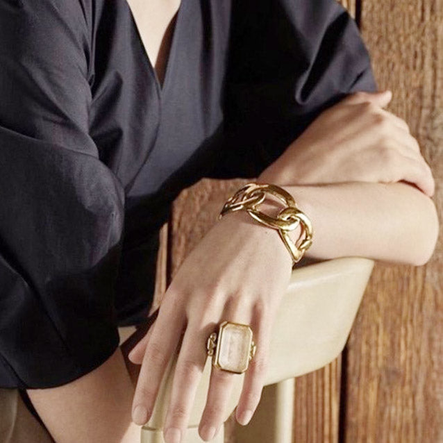 Model showcasing the versatile styling of the gold cuff bangle bracelets