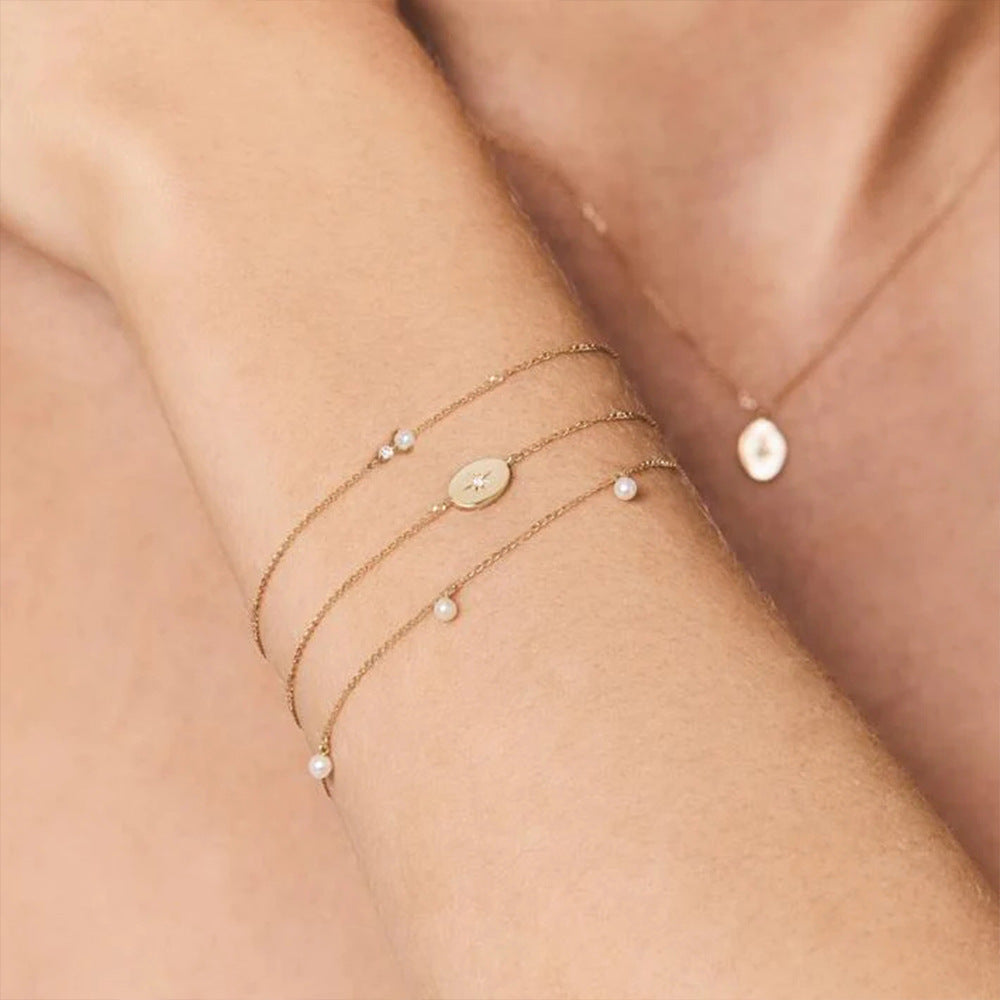 A collection of star-themed bracelets and necklaces in gold finish