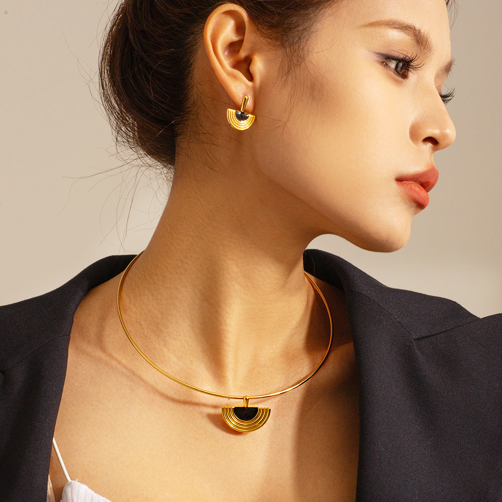 Detailed product shot of the Egyptian fan-shaped necklace and earrings set