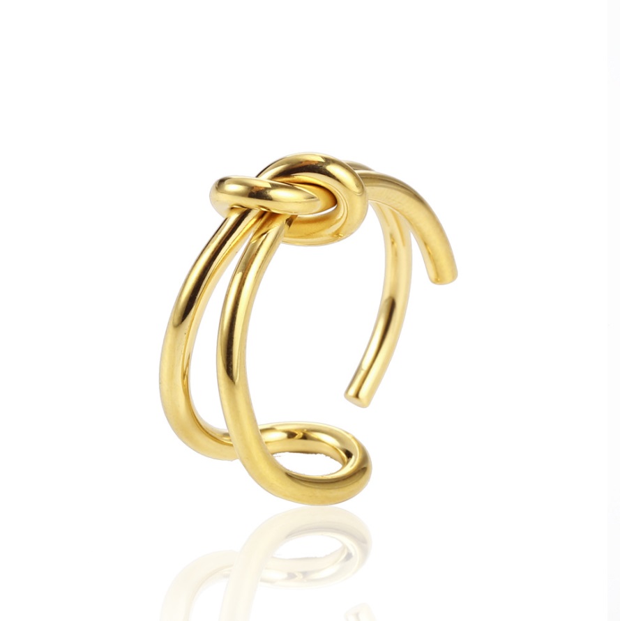 Gold knot earring matching the bow ring