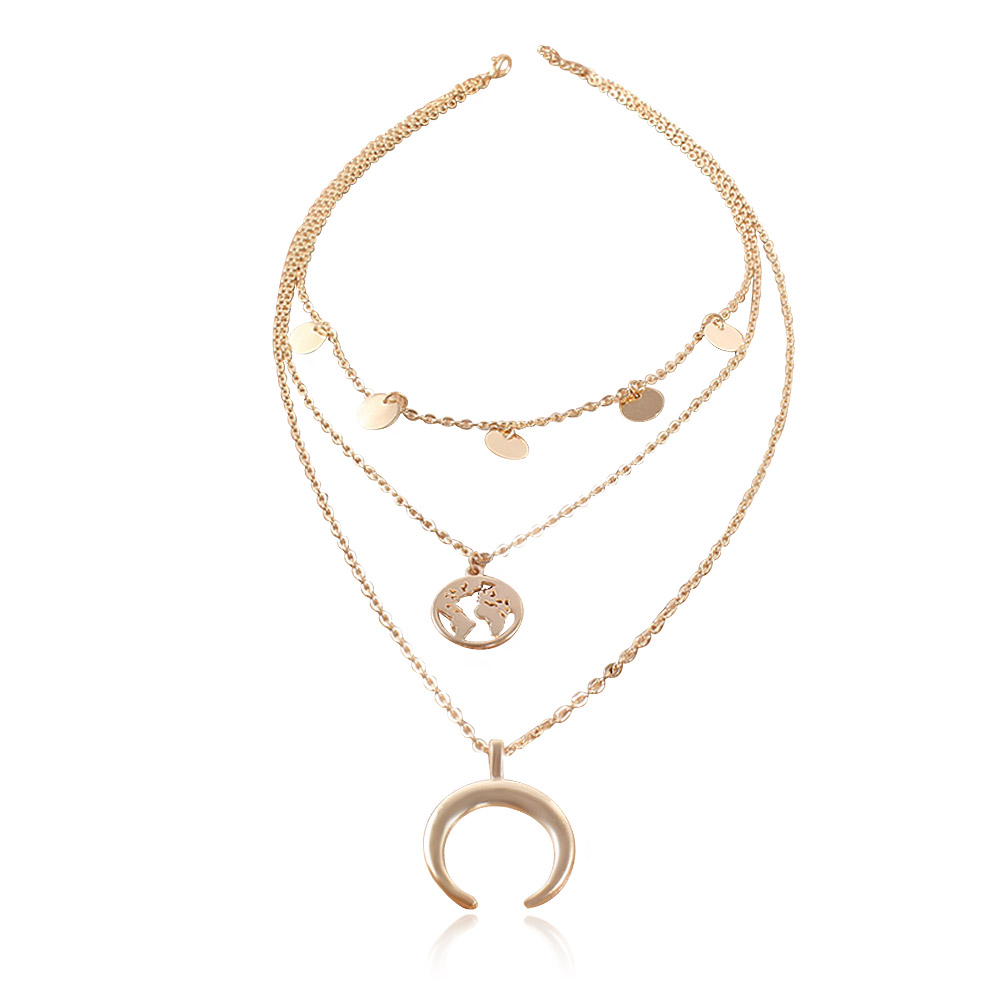 Detailed view of the Upside Down Moon World Map Layer Necklace pendants