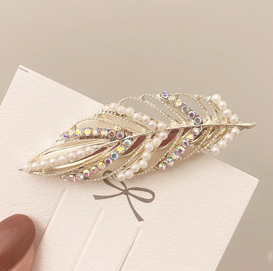 Close-up of the Pearl Crystal Leaf Hair Accessory