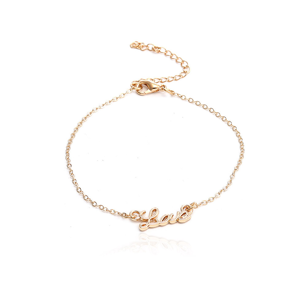 Detail of the gold 'love' charm bracelet