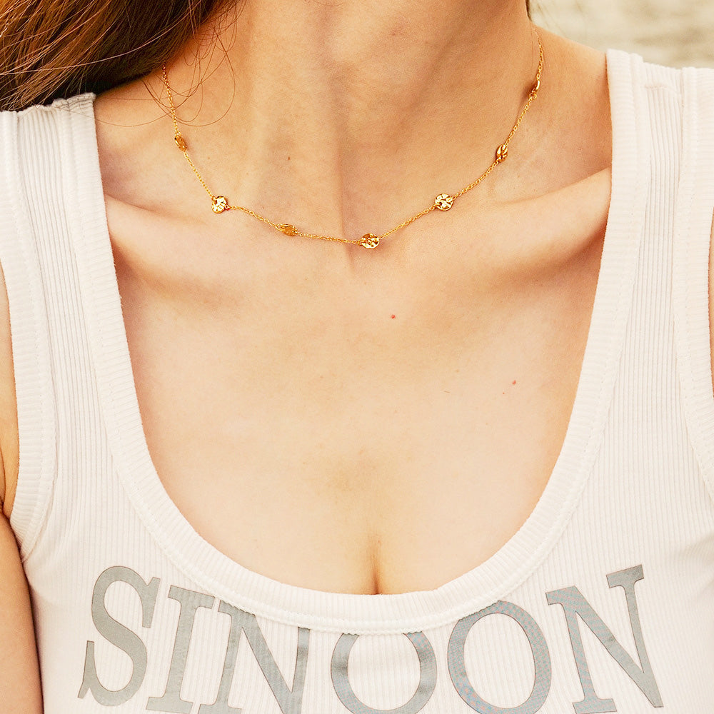 Model wearing the layered stainless steel coin disc charm choker necklace
