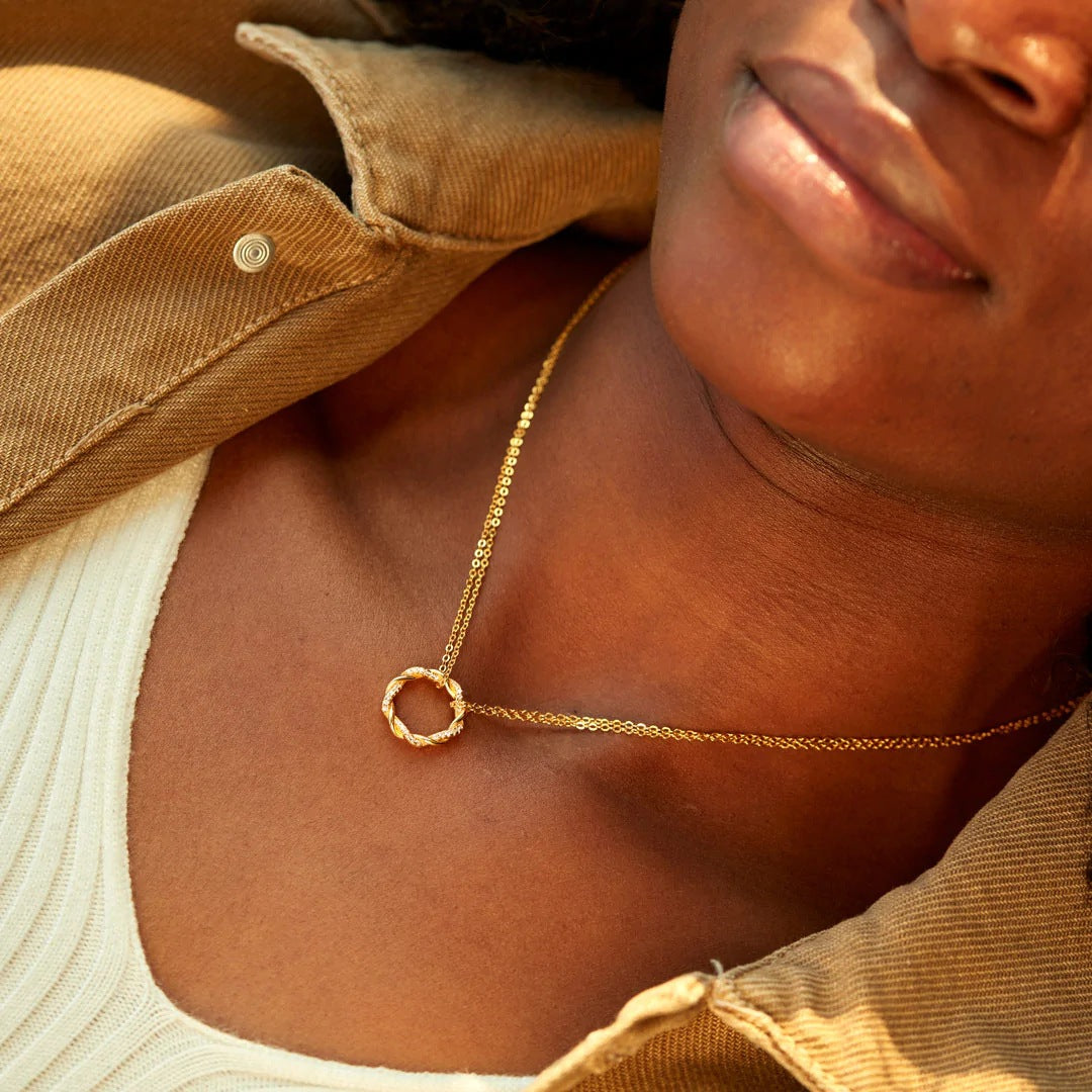 Model showcasing the Twisted Circle Zircon Necklace