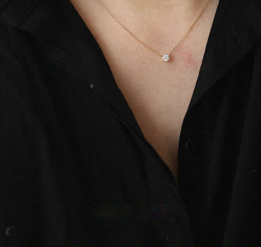 Model showcasing the elegant 925 silver solitaire pendant necklace