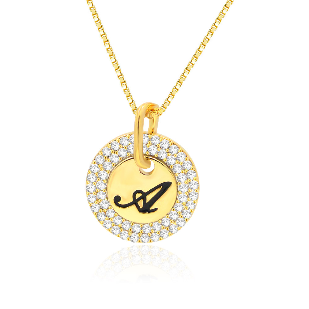 A stylish gold necklace with a circular pendant featuring a black letter 'A' surrounded by white diamonds.