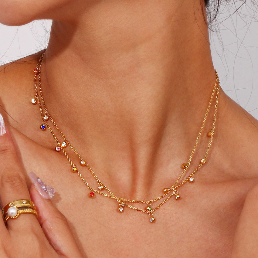 Model showcasing the multicolour zircon dangle necklace