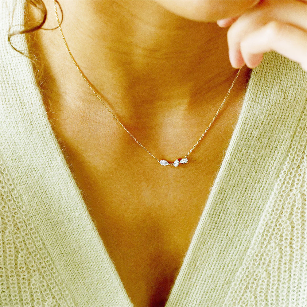 Model showcasing the elegant 925 silver geometric cluster zircon necklace in gold.