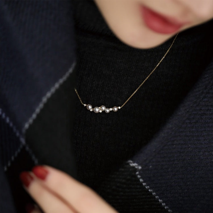 Model showcasing the elegant 18K gold plated shell pearl necklace