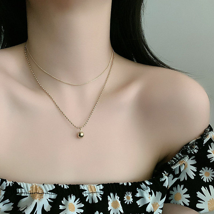 Model wearing the Double Chain Layered Mini Ball Necklace