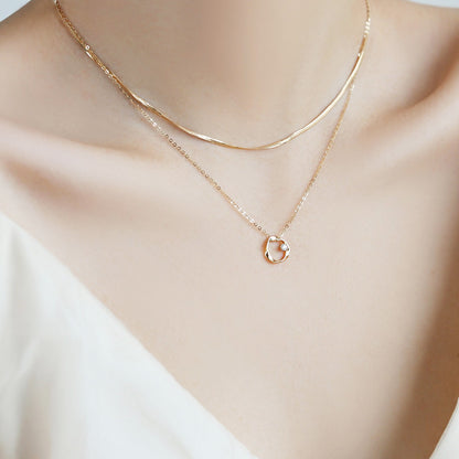 A model wearing the 925 sterling silver Mobius pendant necklace