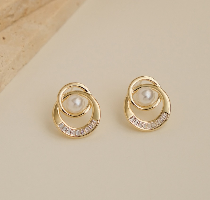 Detailed view of the pearl and crystal setting on the Double Ring Earrings