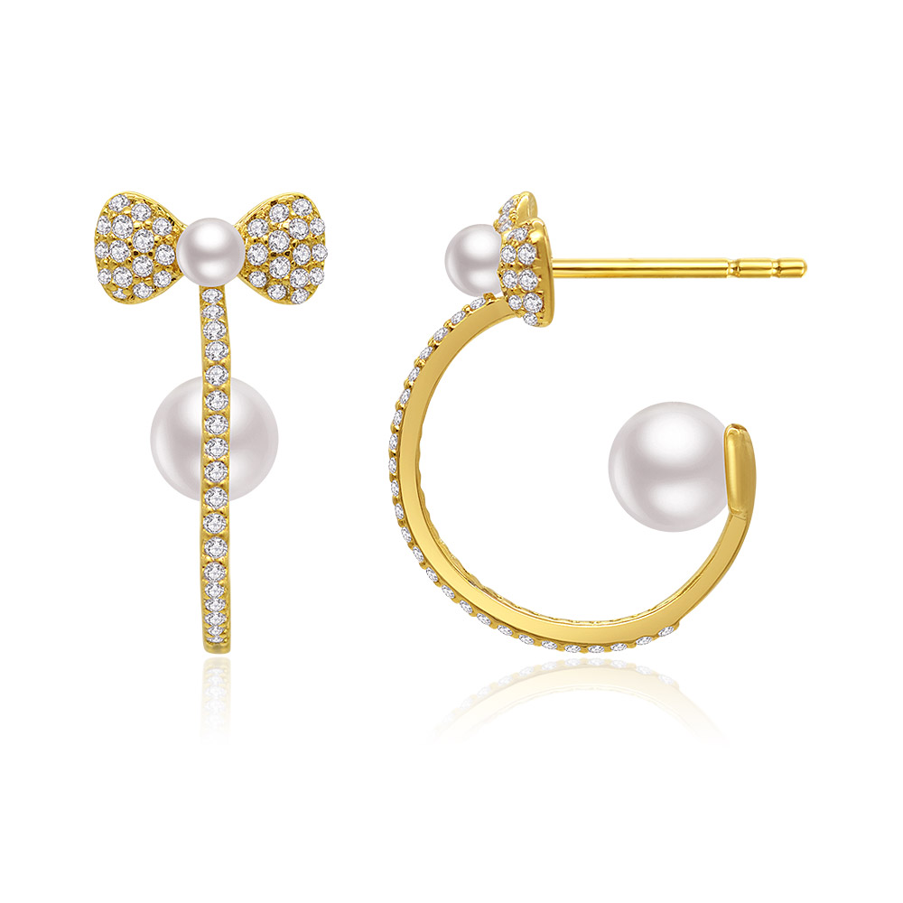 A detailed side view of the Hook Double Pearl Earrings showcasing the brilliant cubic zirconia stones.