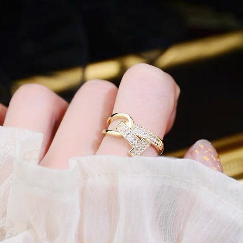 A gold-plated ring with a crisscross zircon design from the five-piece set.